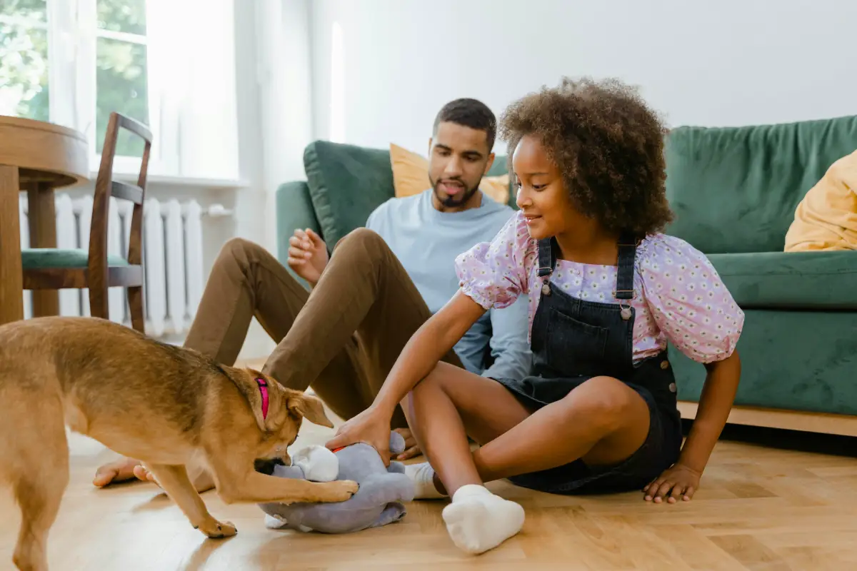 couple with dog in house pet sitting